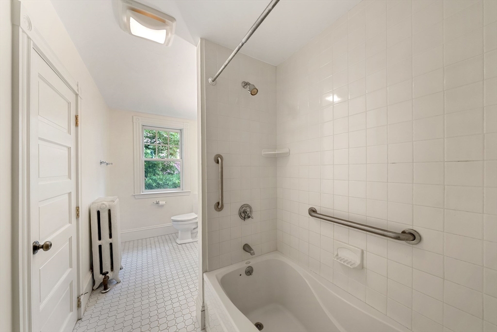 179 Rawson Road, Unit 2 Brookline, MA 02445 - Photo 33 of 42 a bathroom with a bathtub and a shower