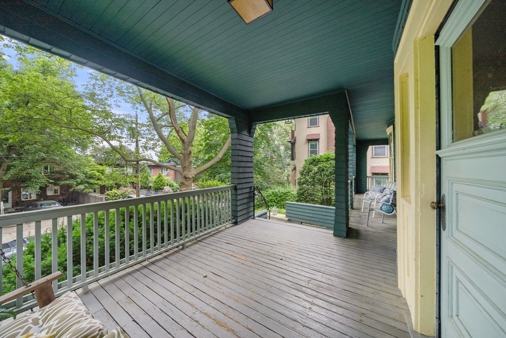 179 Rawson Road, Unit 2 Brookline, MA 02445 - Photo 39 of 42 a view of balcony with floor to ceiling windows with wooden floor