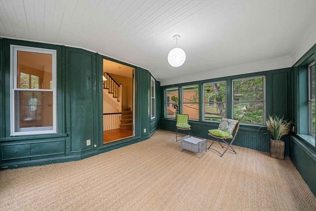 179 Rawson Road, Unit 2 Brookline, MA 02445 - Photo 7 of 42 a living room with furniture and a large window