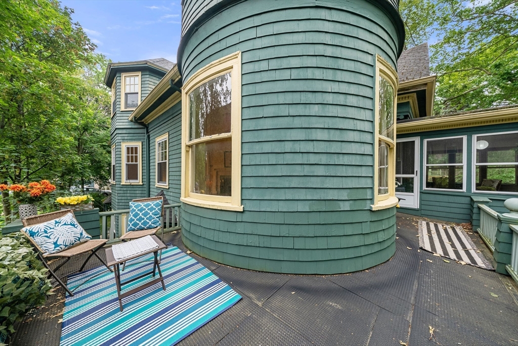 179 Rawson Road, Unit 2 Brookline, MA 02445 - Photo 9 of 42 a view of house with a chairs in patio