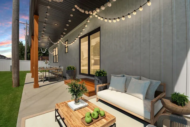 a living room with furniture and a chandelier