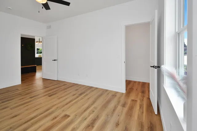 a bathroom with a sink vanity and mirror