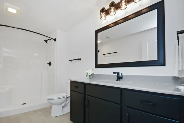 a bed room with a bed and a dresser