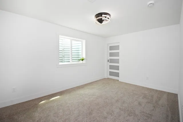 a spacious bathroom with a sink and mirror