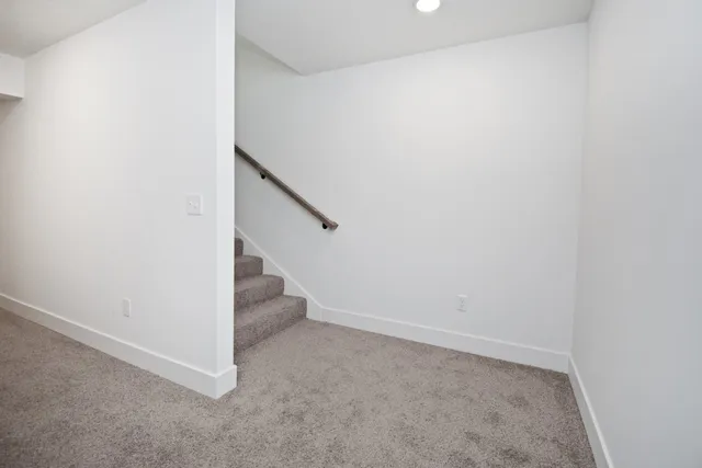 a kitchen with a sink a stove and cabinets