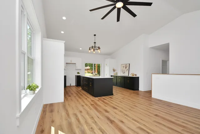 a kitchen with a sink cabinets and window