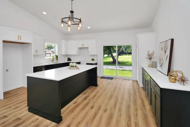 a view of a small space with wooden floor