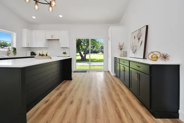a kitchen with stainless steel appliances a stove top oven