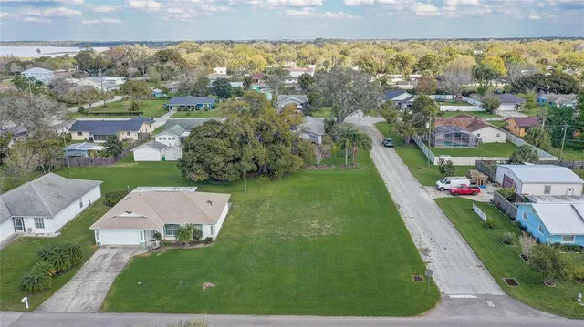a view of a yard with an outdoor seating