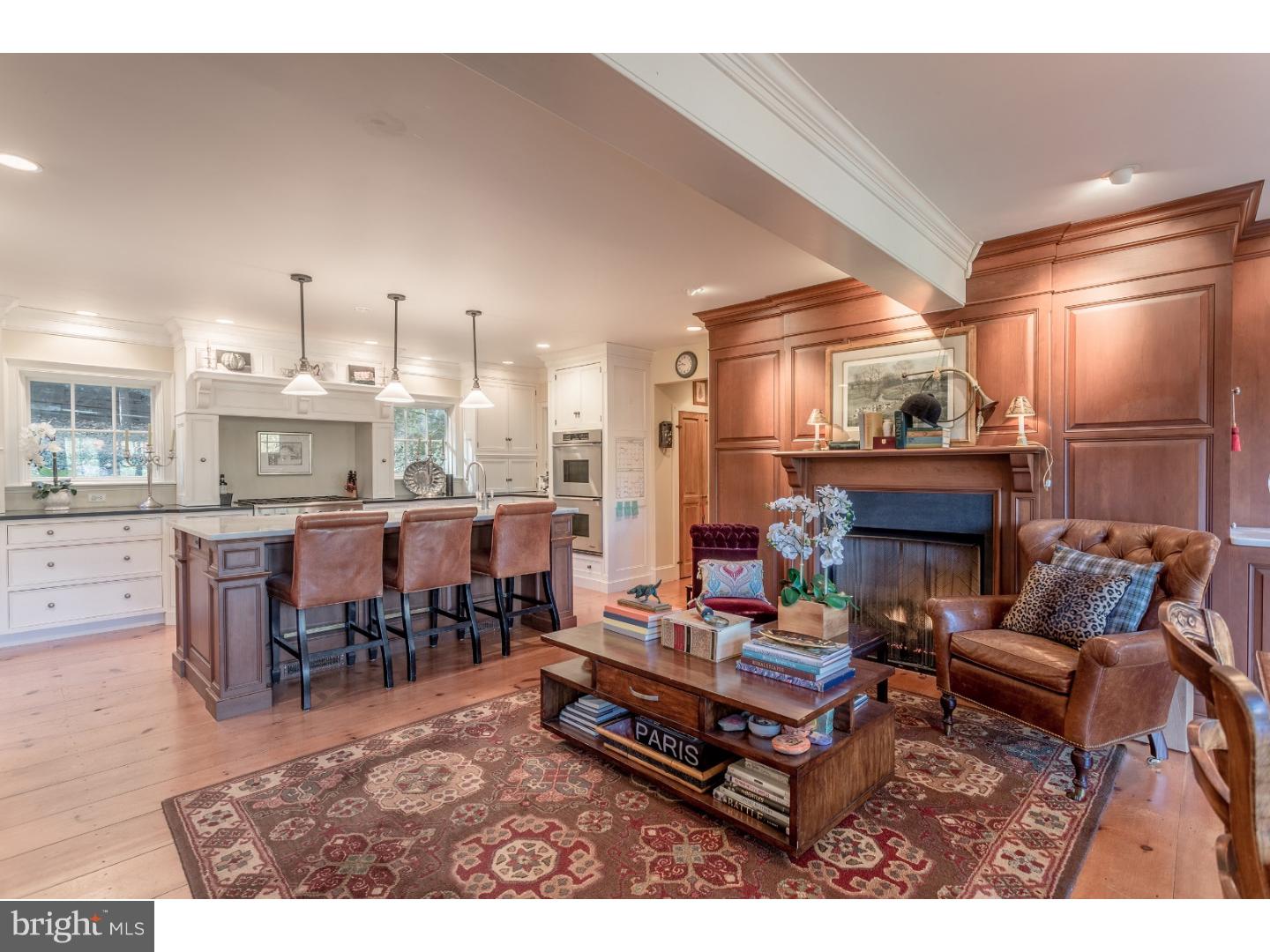 7174 Centerbridge Road New Hope, PA 18938 - Photo 11 of 24 a living room with furniture a fireplace and dining table