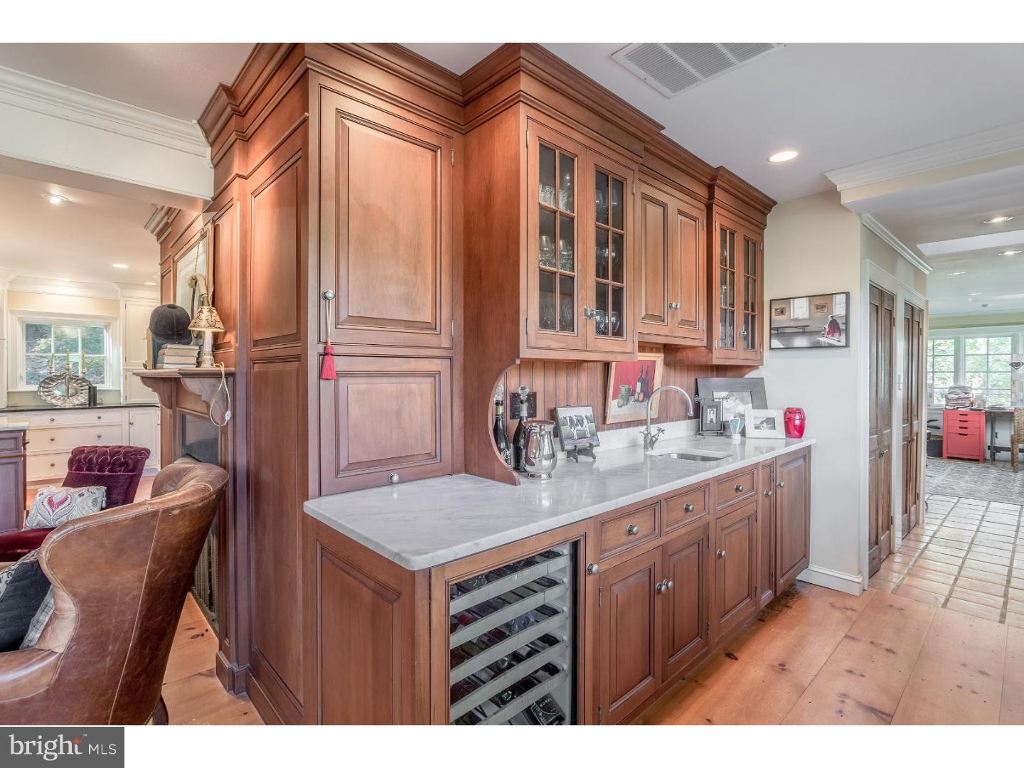7174 Centerbridge Road New Hope, PA 18938 - Photo 15 of 24 a kitchen that has a lot of cabinets in it and wooden floors