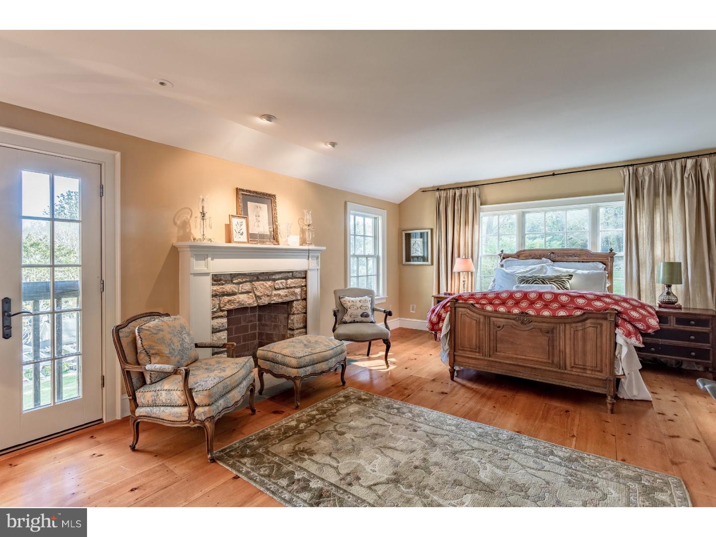 7174 Centerbridge Road New Hope, PA 18938 - Photo 17 of 24 a bedroom with a bed and a couch