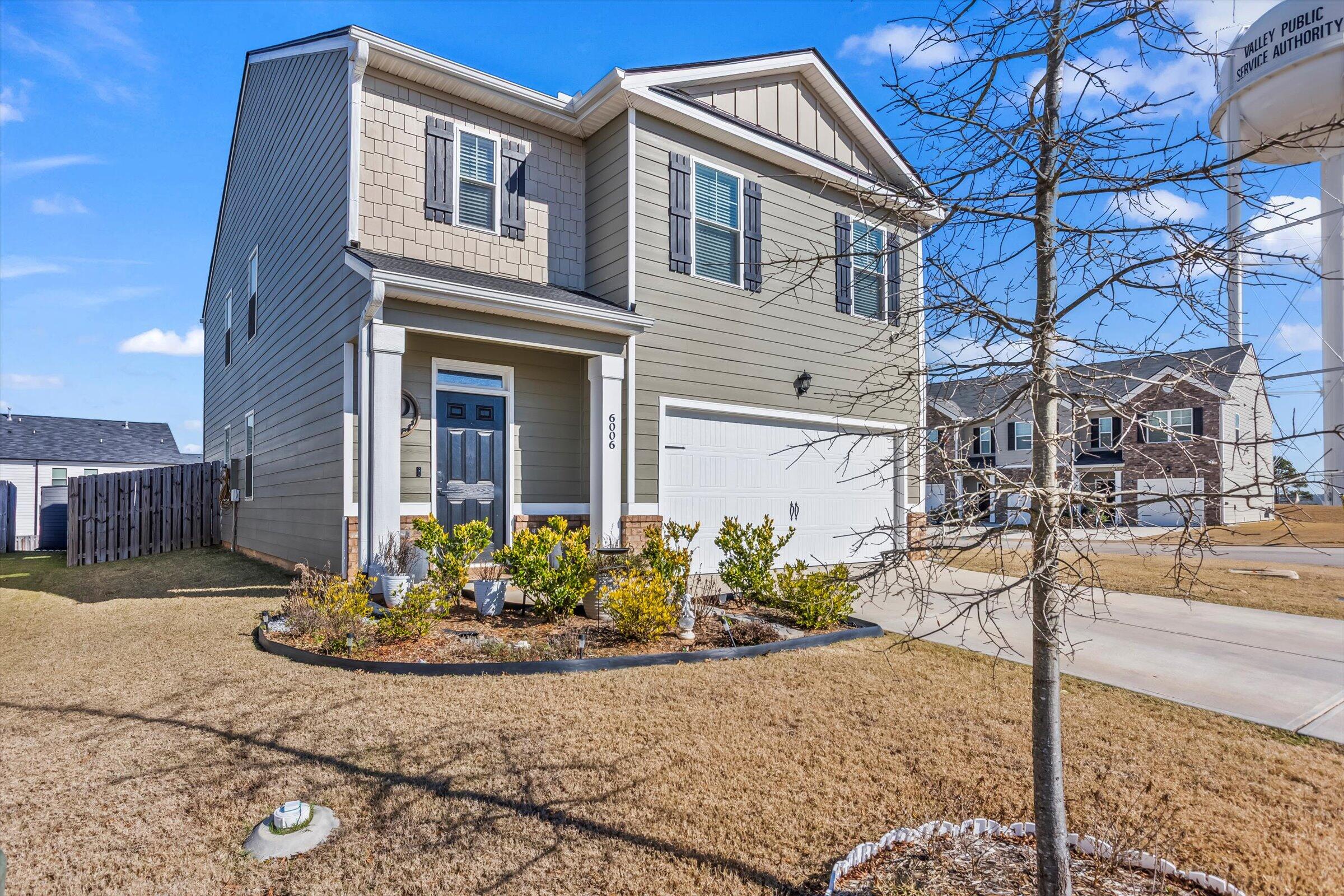 6006 Beadlow Street Aiken, SC 29801 - Photo 2 of 14 a front view of a house with a yard