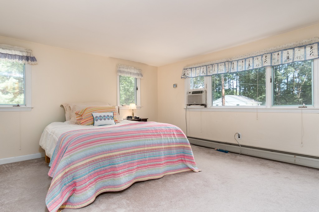 22 Leigh Road Wenham, MA 01984 - Photo 14 of 28 a bedroom with a bed and window