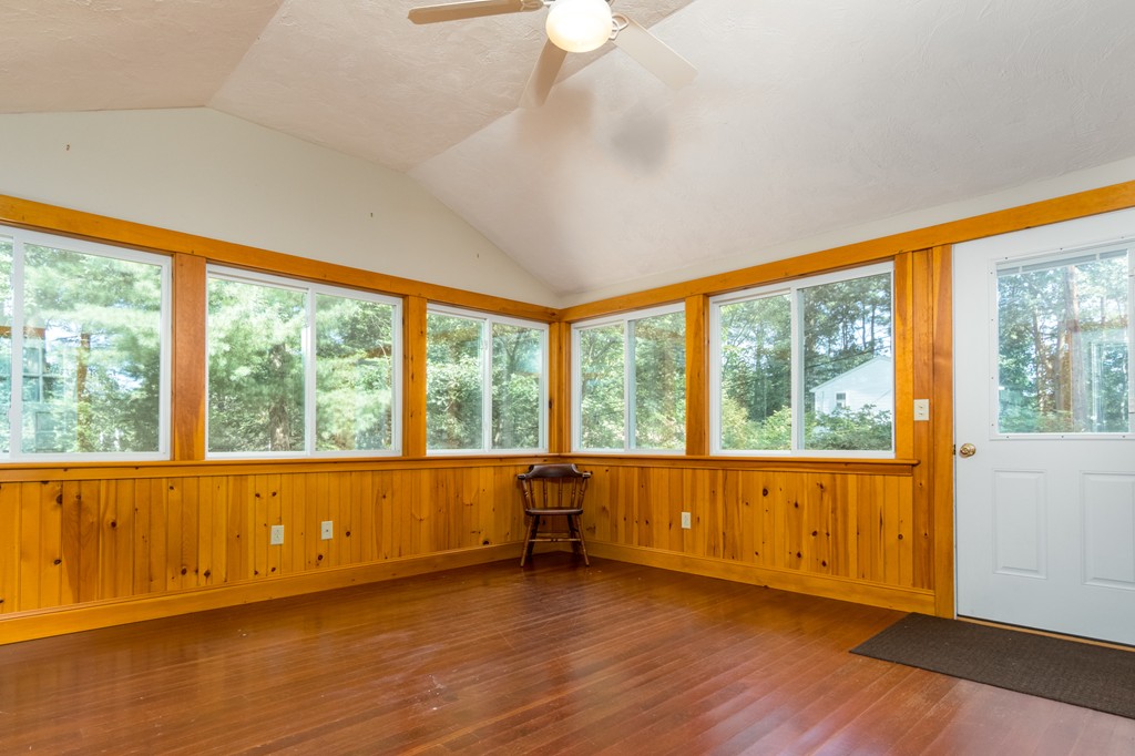 22 Leigh Road Wenham, MA 01984 - Photo 17 of 28 a view of an empty room with wooden floor and a window