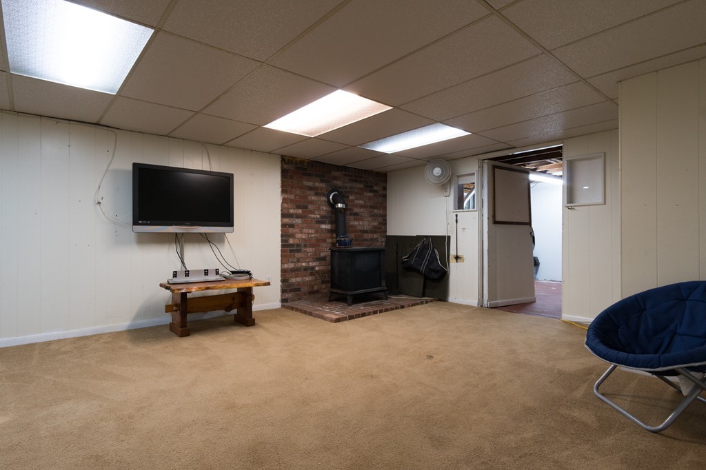 22 Leigh Road Wenham, MA 01984 - Photo 20 of 28 a living room with furniture and a flat screen tv