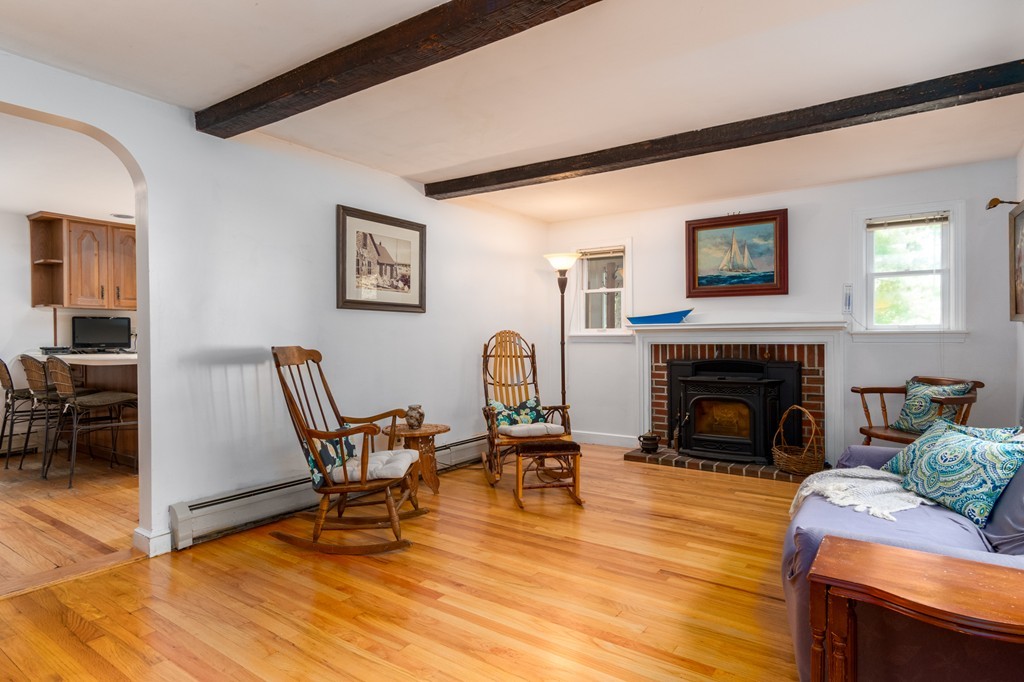 22 Leigh Road Wenham, MA 01984 - Photo 4 of 28 a living room with furniture and a fireplace