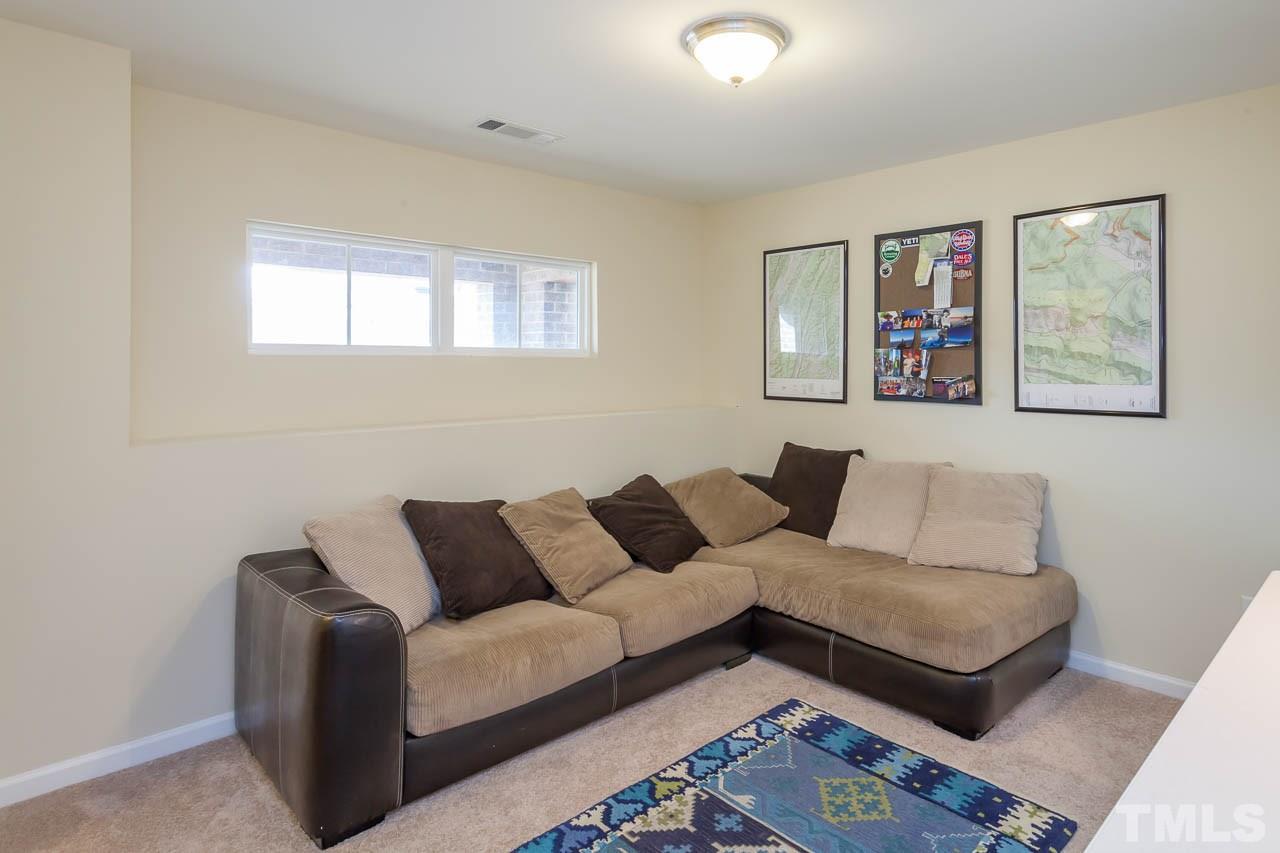 1651 Crafton Way Raleigh, NC 27607 - Photo 14 of 20 a living room with furniture and a window