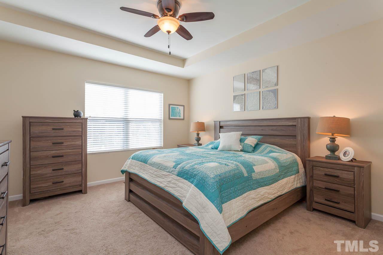 1651 Crafton Way Raleigh, NC 27607 - Photo 10 of 20 a bedroom with a bed and a window