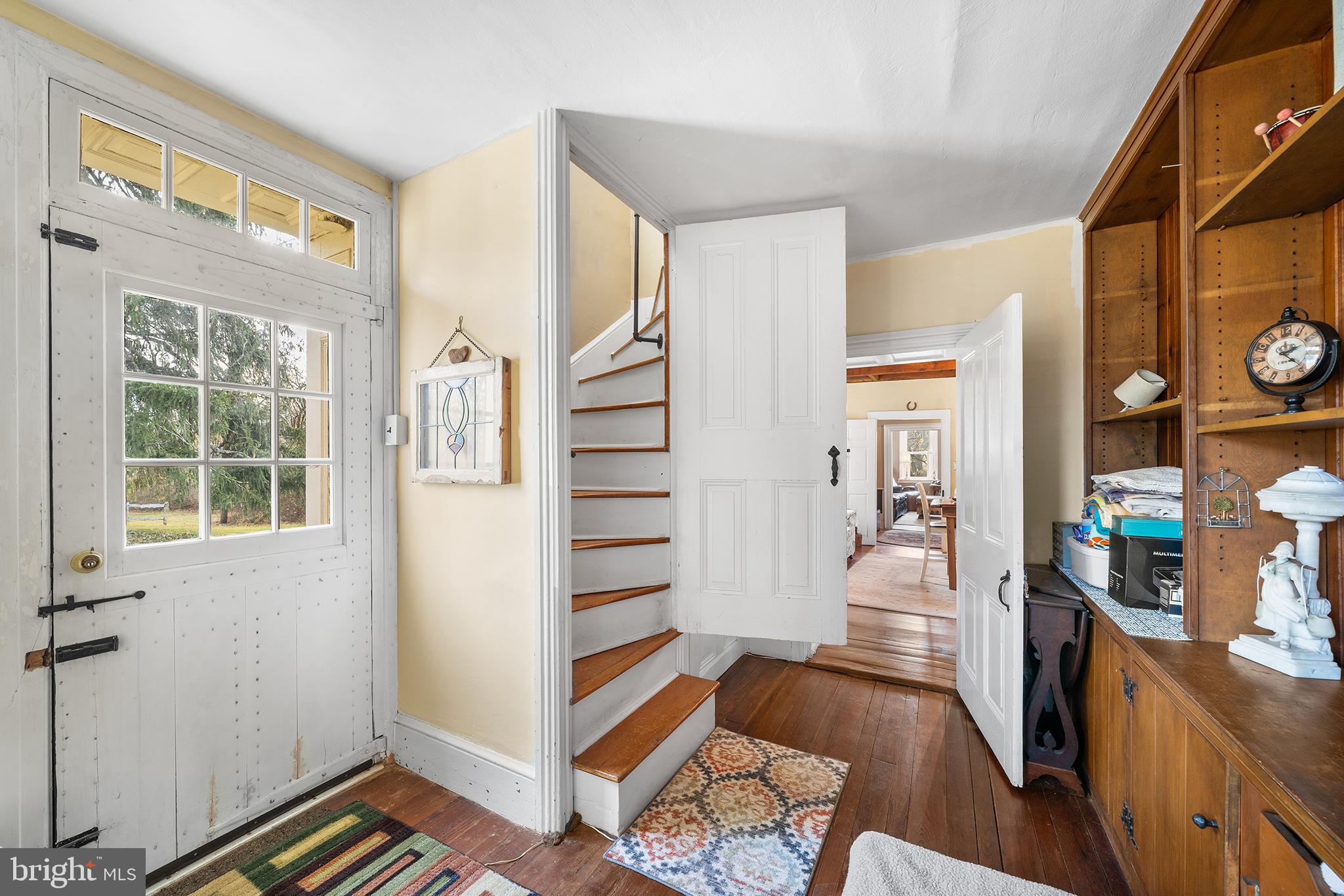 206 Twinbrook Road Perkasie, PA 18944 - Photo 18 of 46 a view of a hallway to a livingroom with wooden floor and furniture