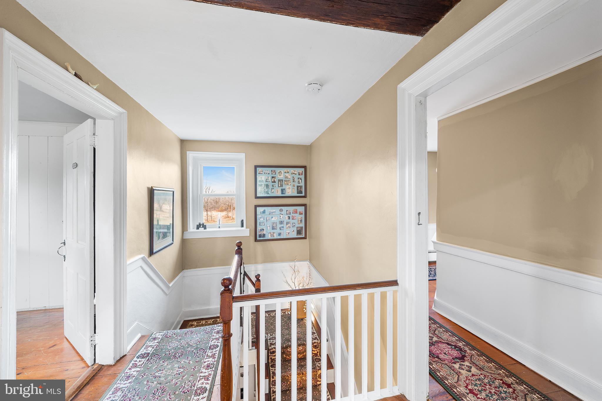 206 Twinbrook Road Perkasie, PA 18944 - Photo 21 of 46 a view of a hallway with a livingroom with wooden floor and furniture