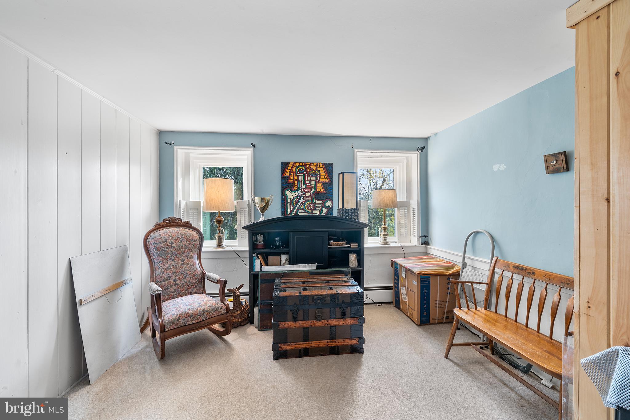 206 Twinbrook Road Perkasie, PA 18944 - Photo 24 of 46 a living room with furniture a fireplace and a large window