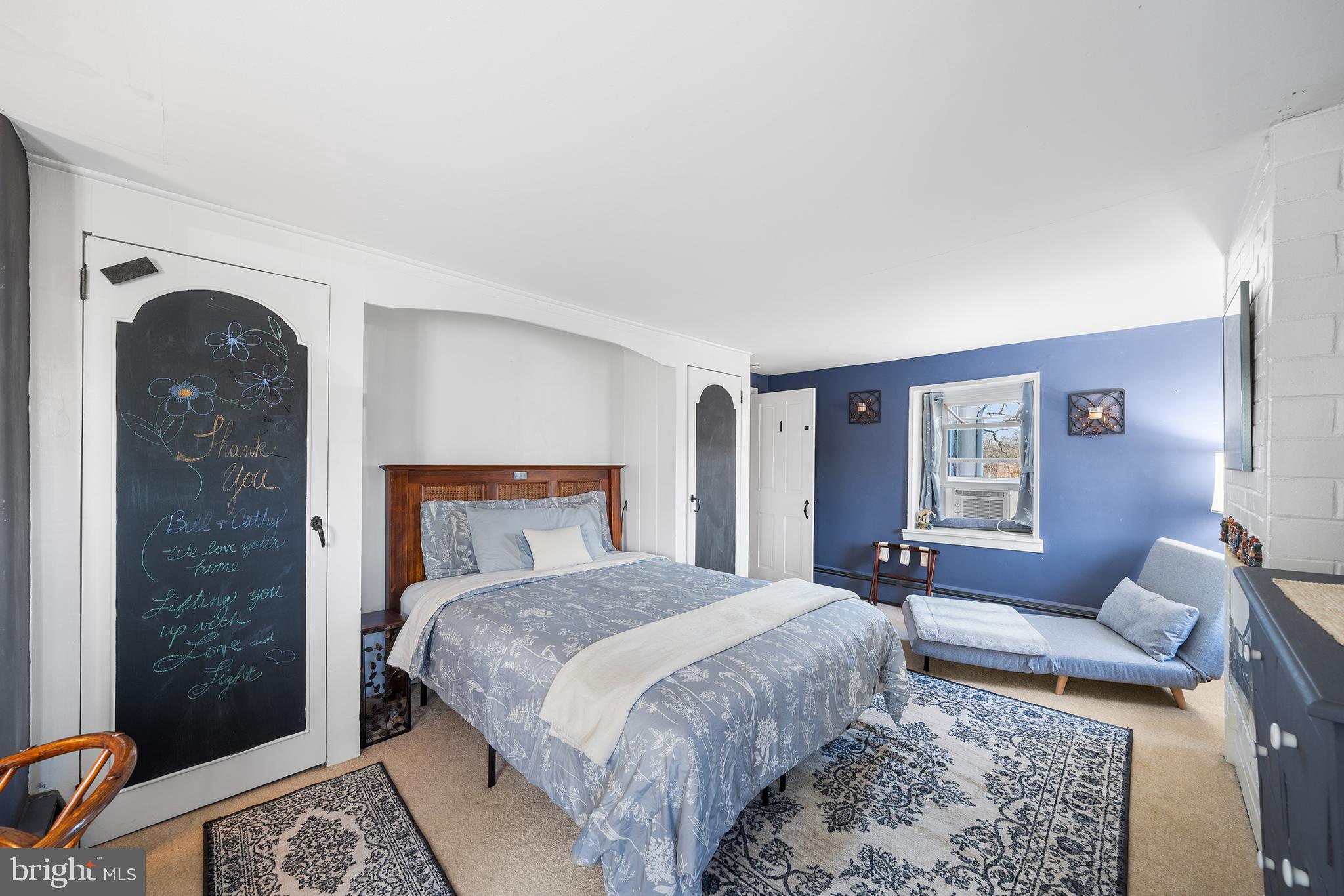 206 Twinbrook Road Perkasie, PA 18944 - Photo 27 of 46 a bedroom with a bed and a couch