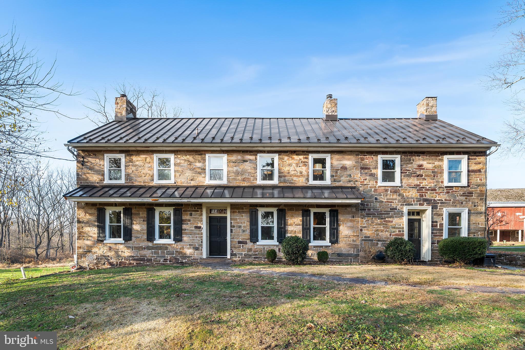 206 Twinbrook Road Perkasie, PA 18944 - Photo 5 of 46 a front view of a residential apartment building with a yard