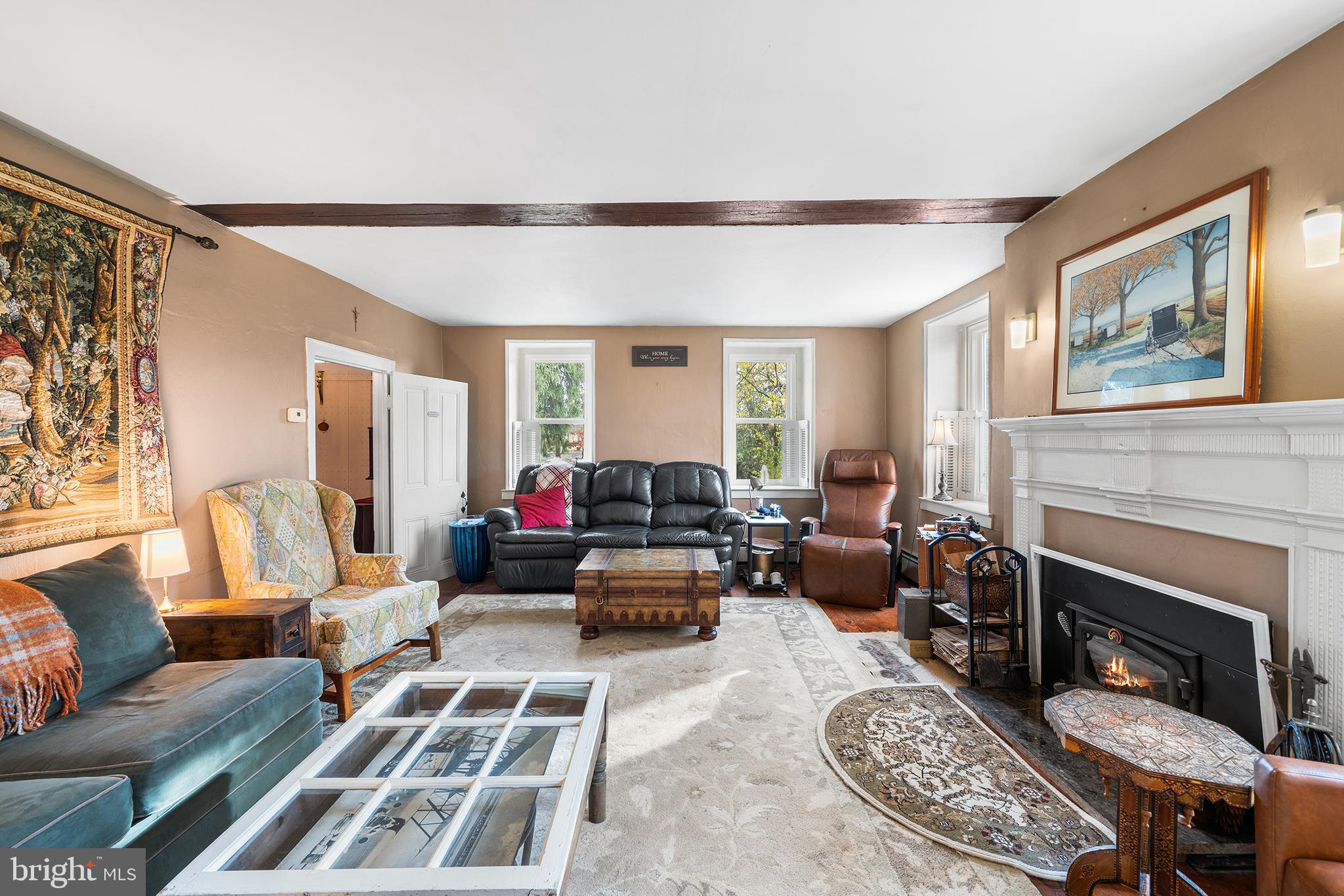 206 Twinbrook Road Perkasie, PA 18944 - Photo 8 of 46 a living room with furniture windows and a fireplace