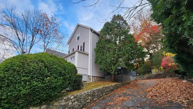 a view of a house with a tree
