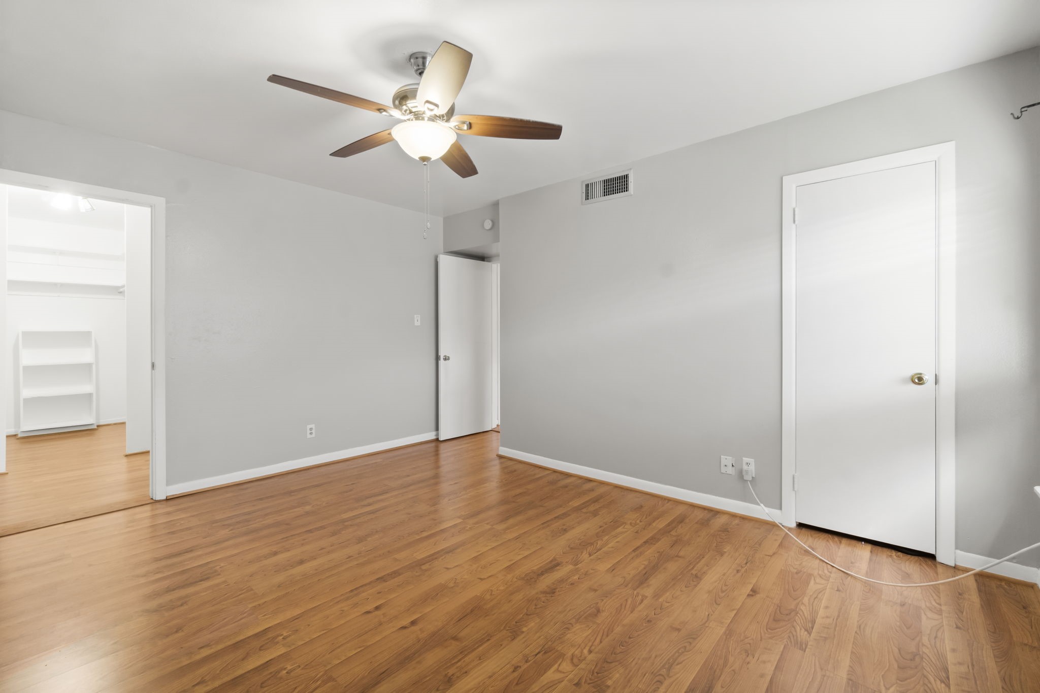 2824 Briarhurst Drive, Unit 14 Houston, TX 77057 - Photo 17 of 26 a view of an empty room with wooden floor