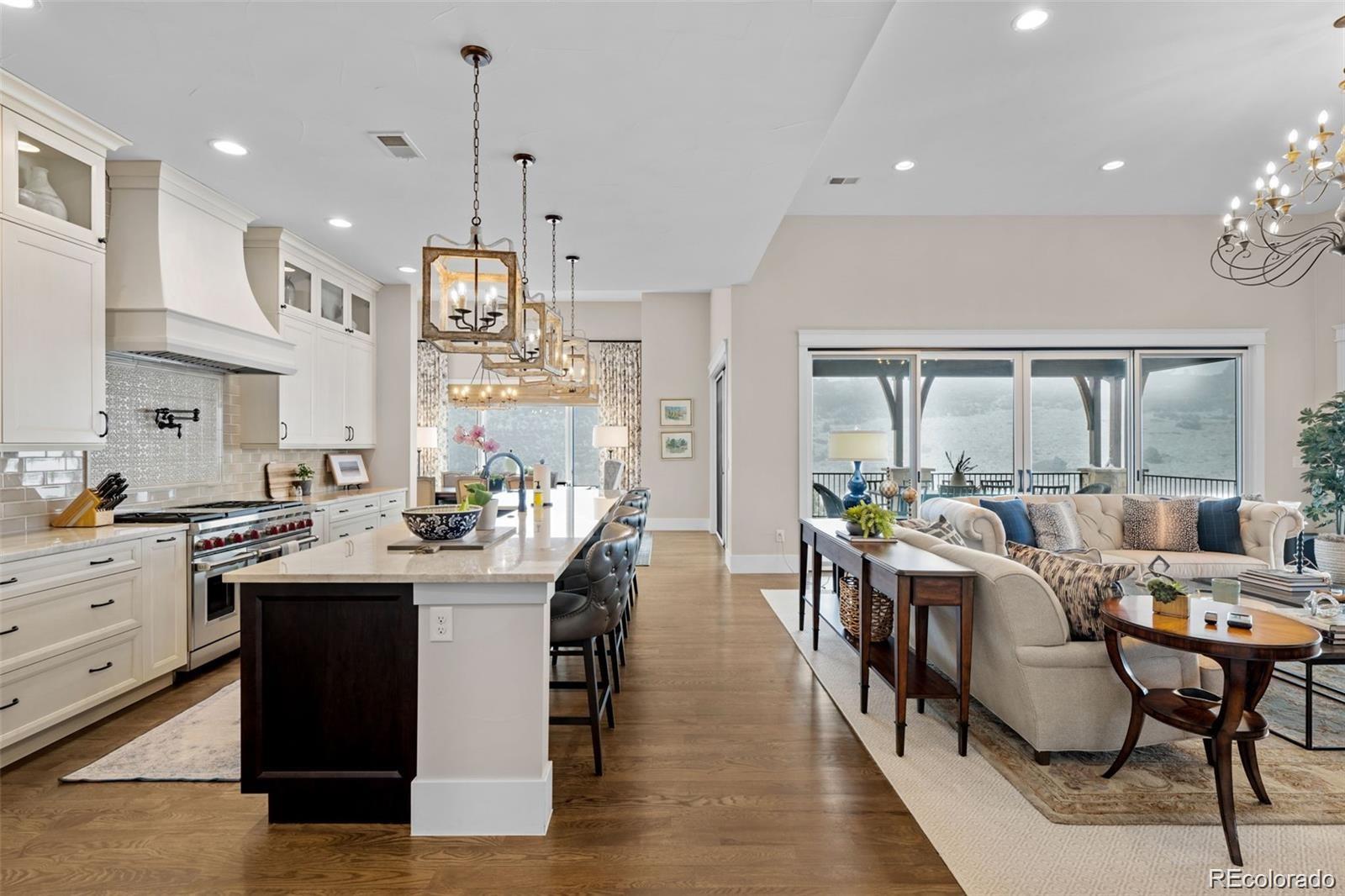 7912 Raphael Lane Littleton, CO 80125 - Photo 14 of 50 a view of a dining room with furniture window and outside view
