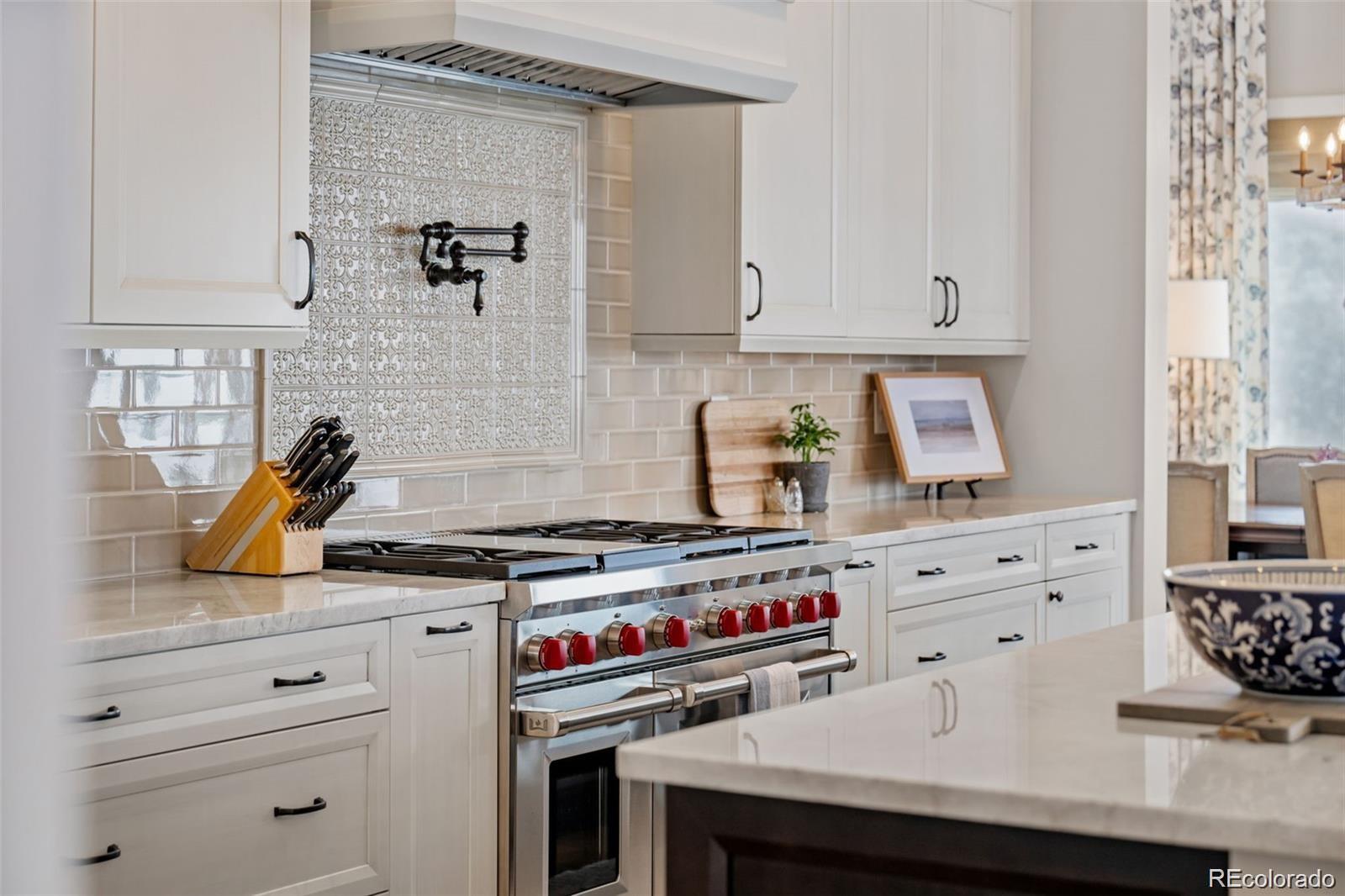 7912 Raphael Lane Littleton, CO 80125 - Photo 15 of 50 a kitchen with a stove and cabinets