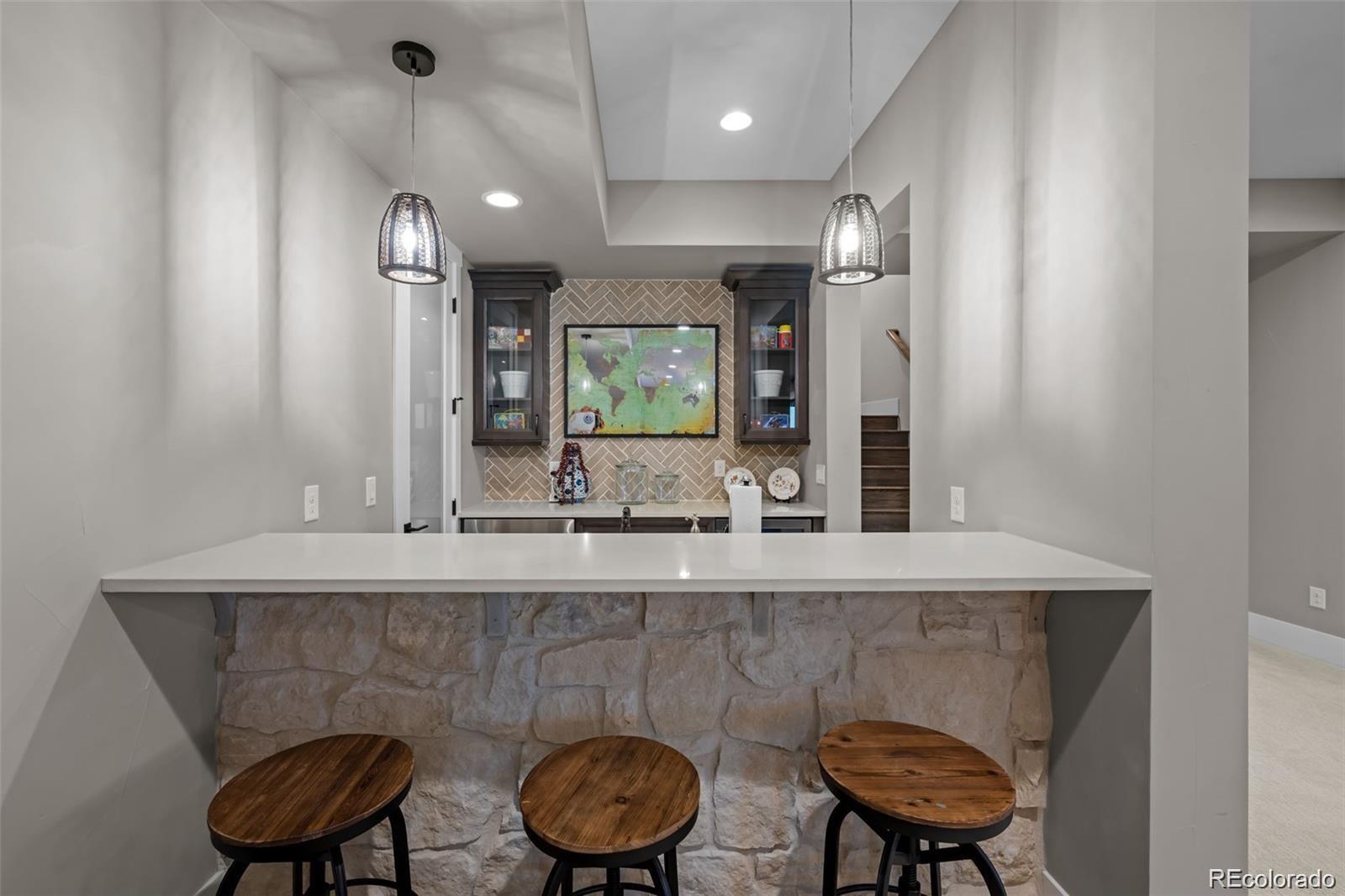 7912 Raphael Lane Littleton, CO 80125 - Photo 34 of 50 a bathroom with a sink a mirror and a toilet