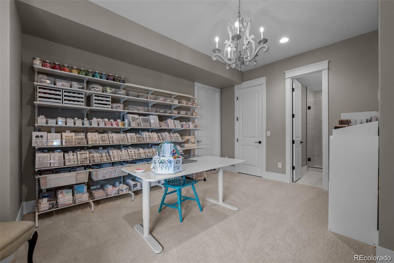 7912 Raphael Lane Littleton, CO 80125 - Photo 40 of 50 a view of a livingroom with furniture and a chandelier