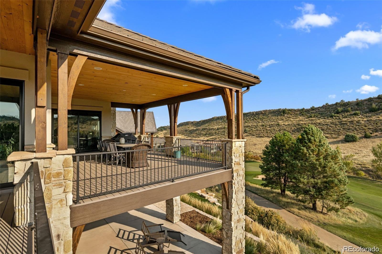 7912 Raphael Lane Littleton, CO 80125 - Photo 44 of 50 a view of balcony with floor to ceiling windows and stairs