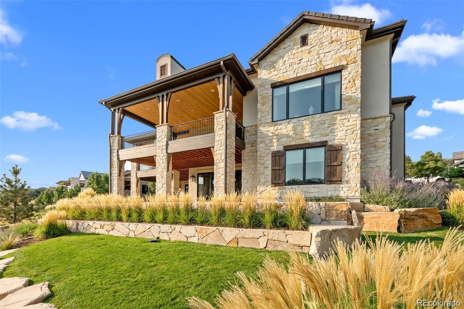 7912 Raphael Lane Littleton, CO 80125 - Photo 48 of 50 a front view of a house with a yard