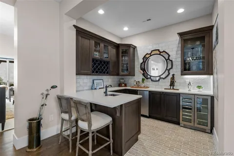 a hall with sink and view of living room