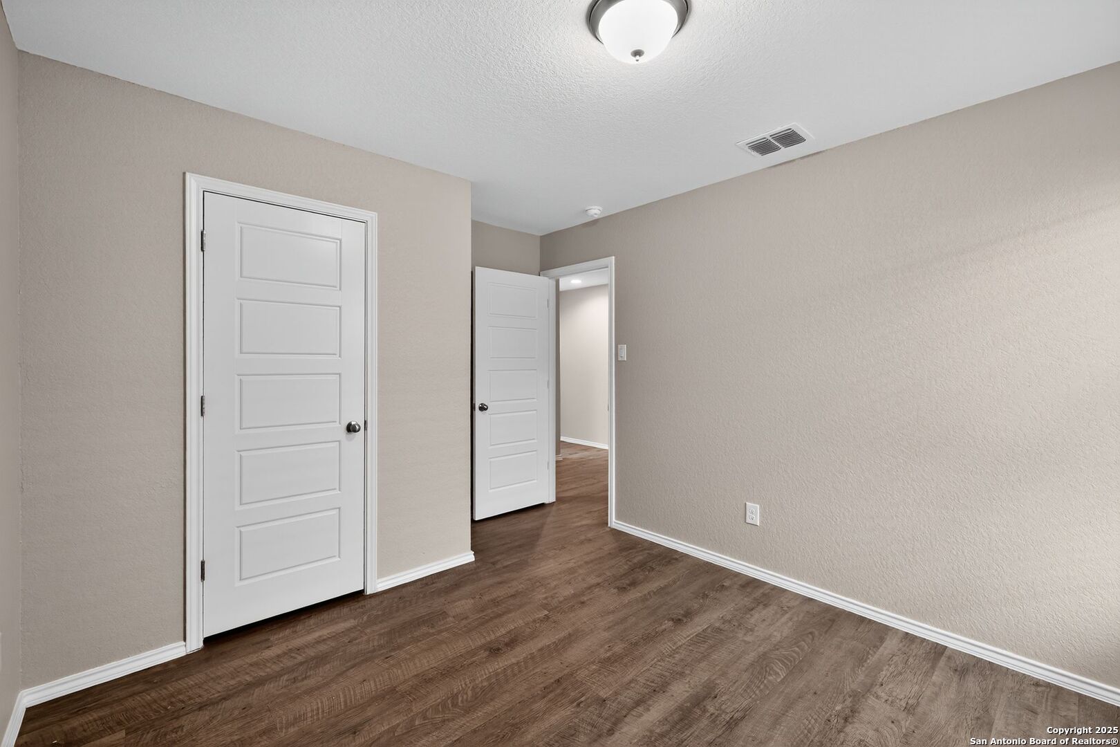 3921 Asher Alley St. Hedwig, TX 78152 - Photo 15 of 30 a view of an empty room with wooden floor
