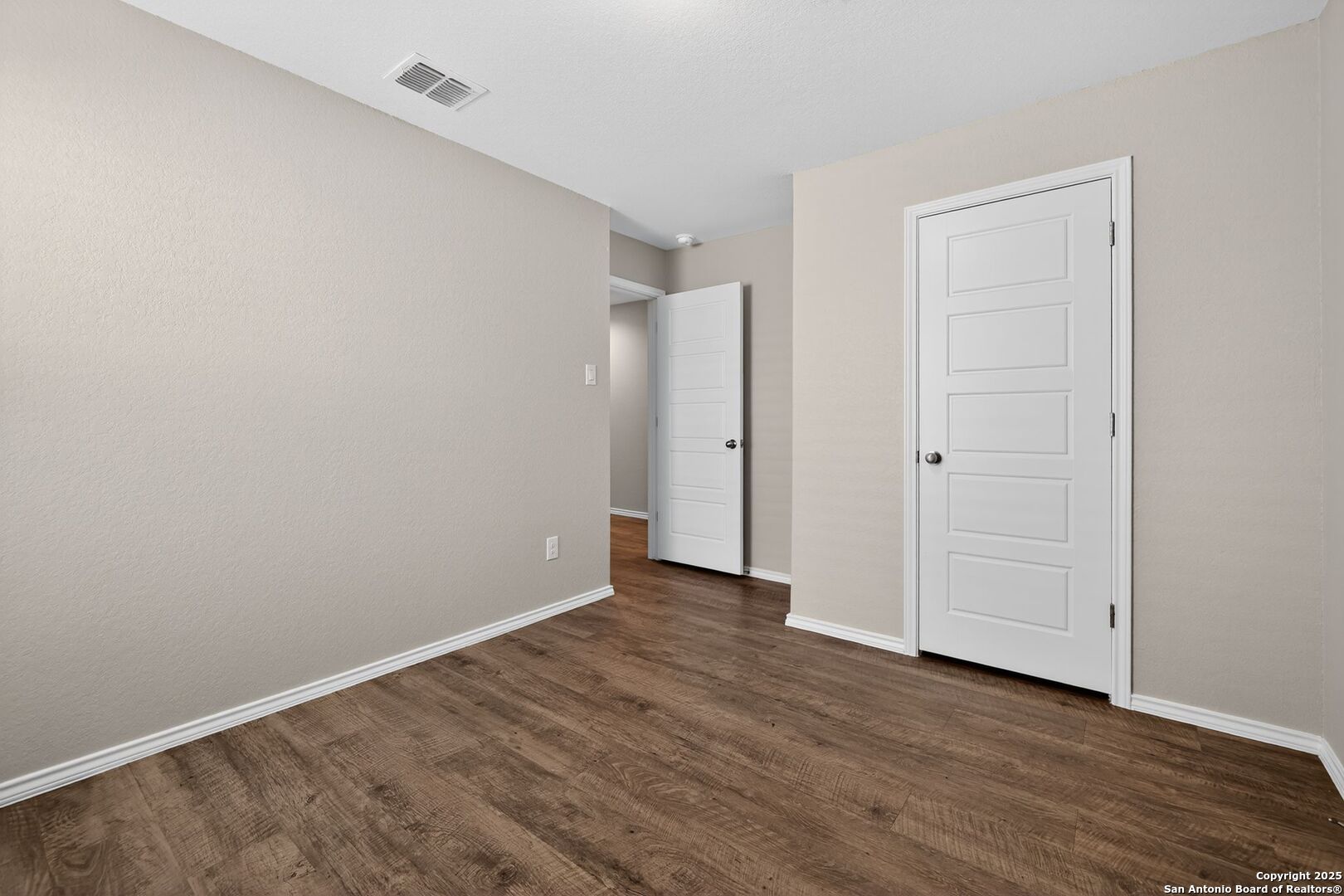 3921 Asher Alley St. Hedwig, TX 78152 - Photo 24 of 30 a view of an empty room with wooden floor and closet