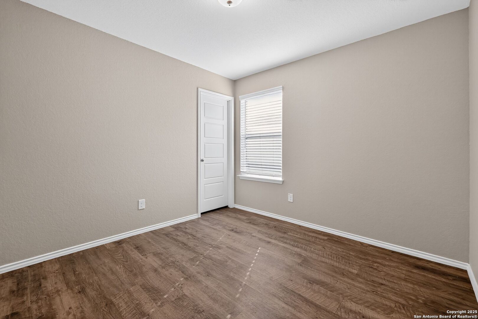 3921 Asher Alley St. Hedwig, TX 78152 - Photo 26 of 30 a view of an empty room with wooden floor