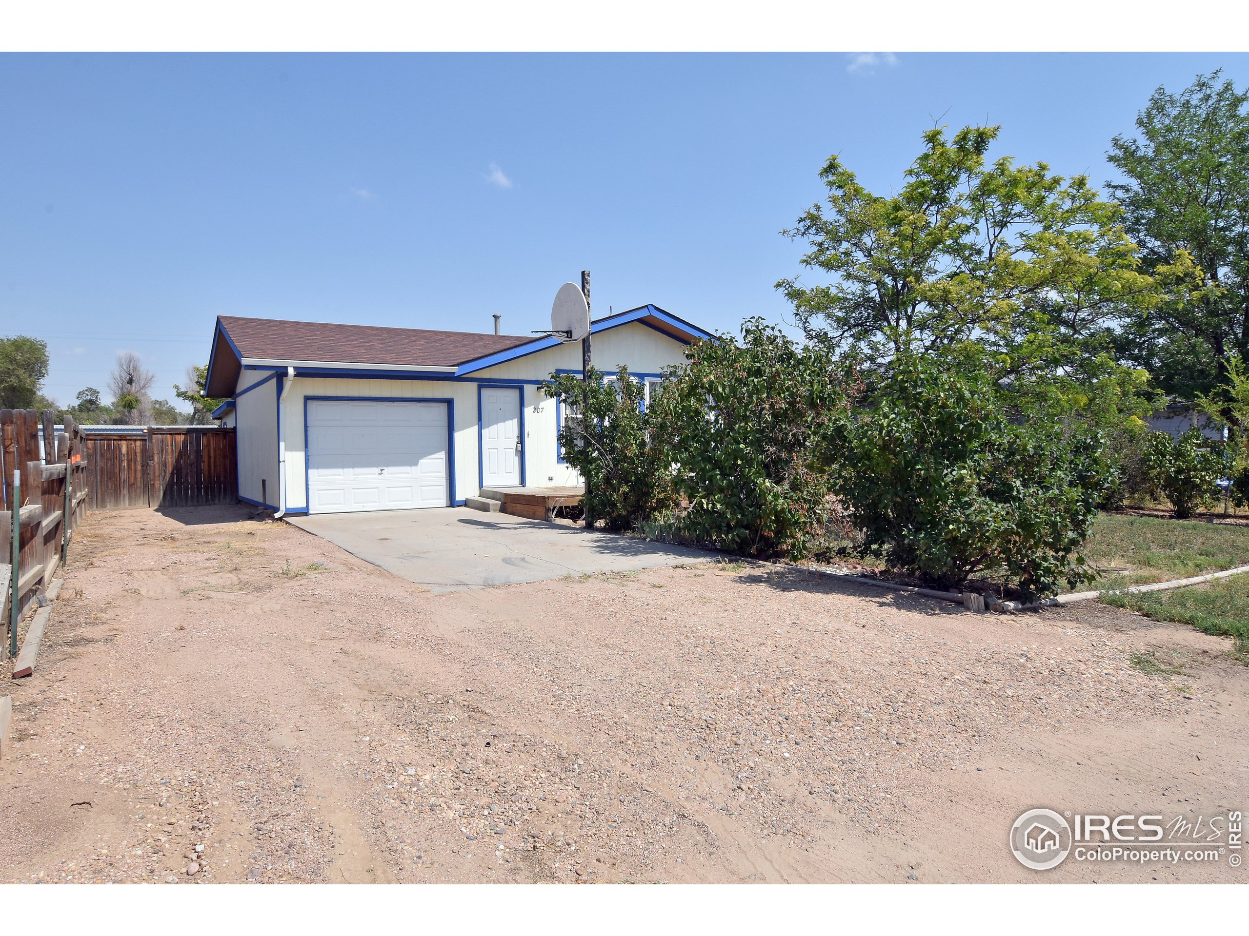 207 Cave Avenue Pierce, CO 80650 - Photo 1 of 35 a view of a house with a yard