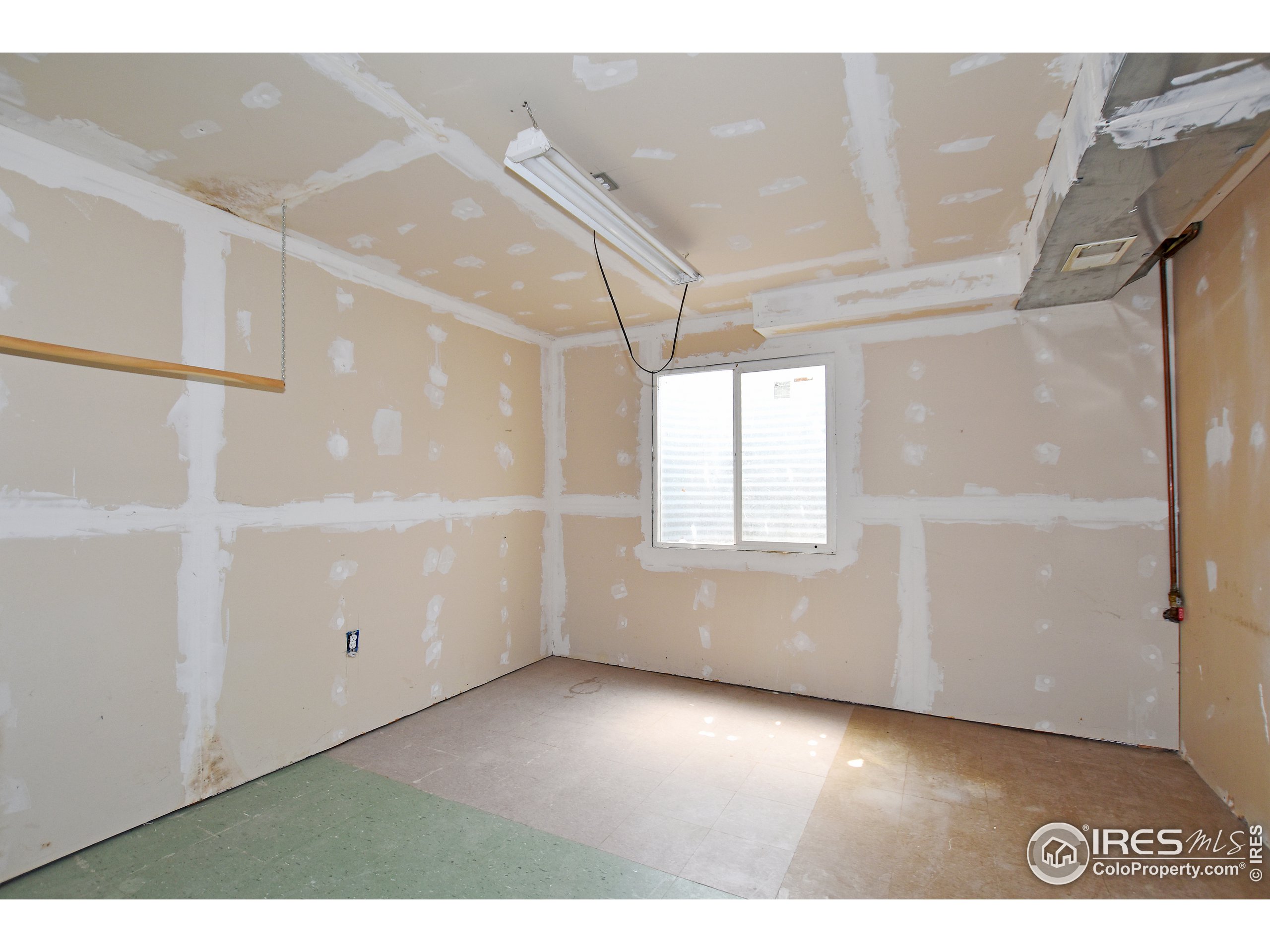 207 Cave Avenue Pierce, CO 80650 - Photo 28 of 35 a view of an empty room with a window
