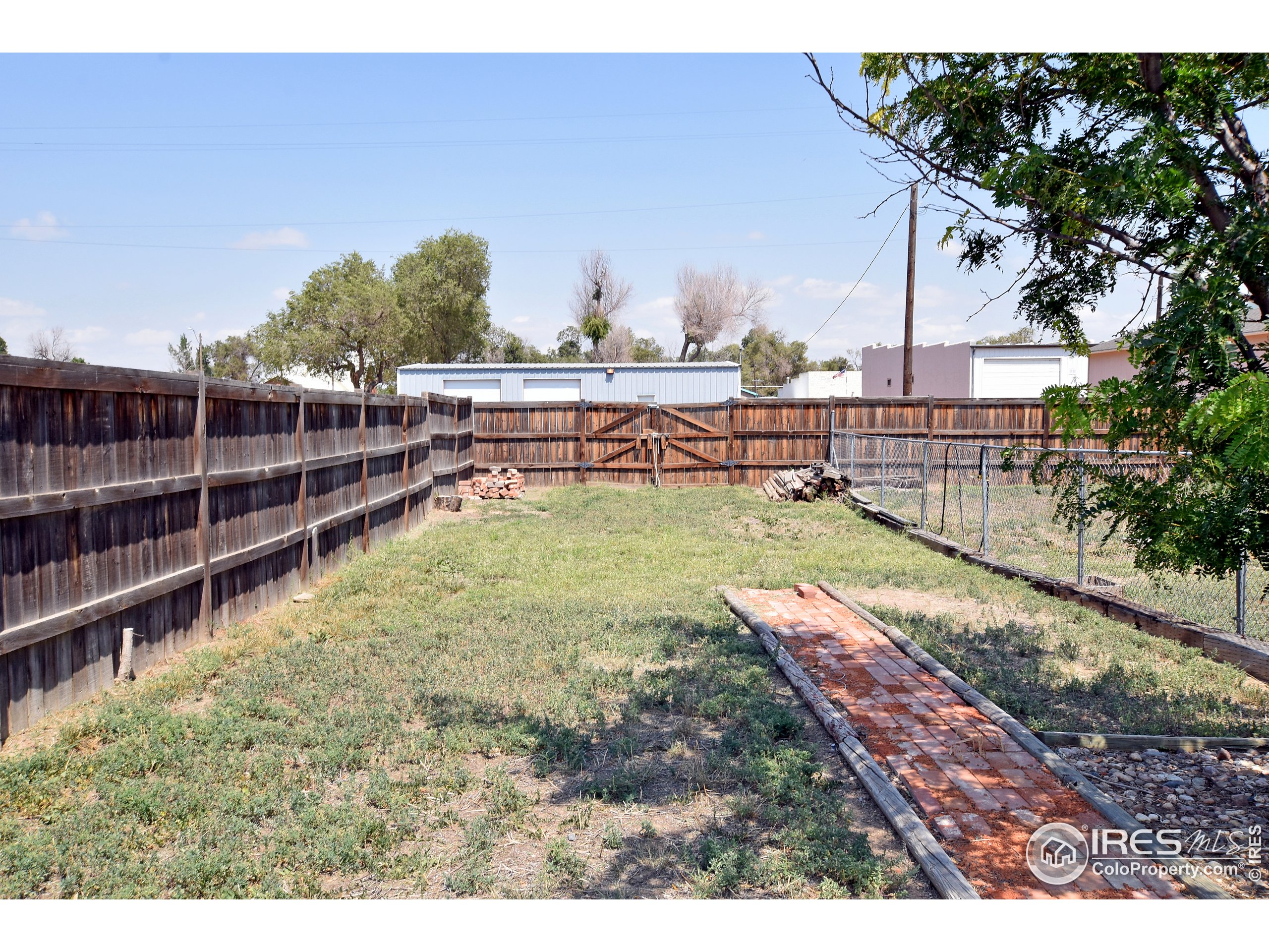 207 Cave Avenue Pierce, CO 80650 - Photo 30 of 35 a view of a backyard with a sitting area