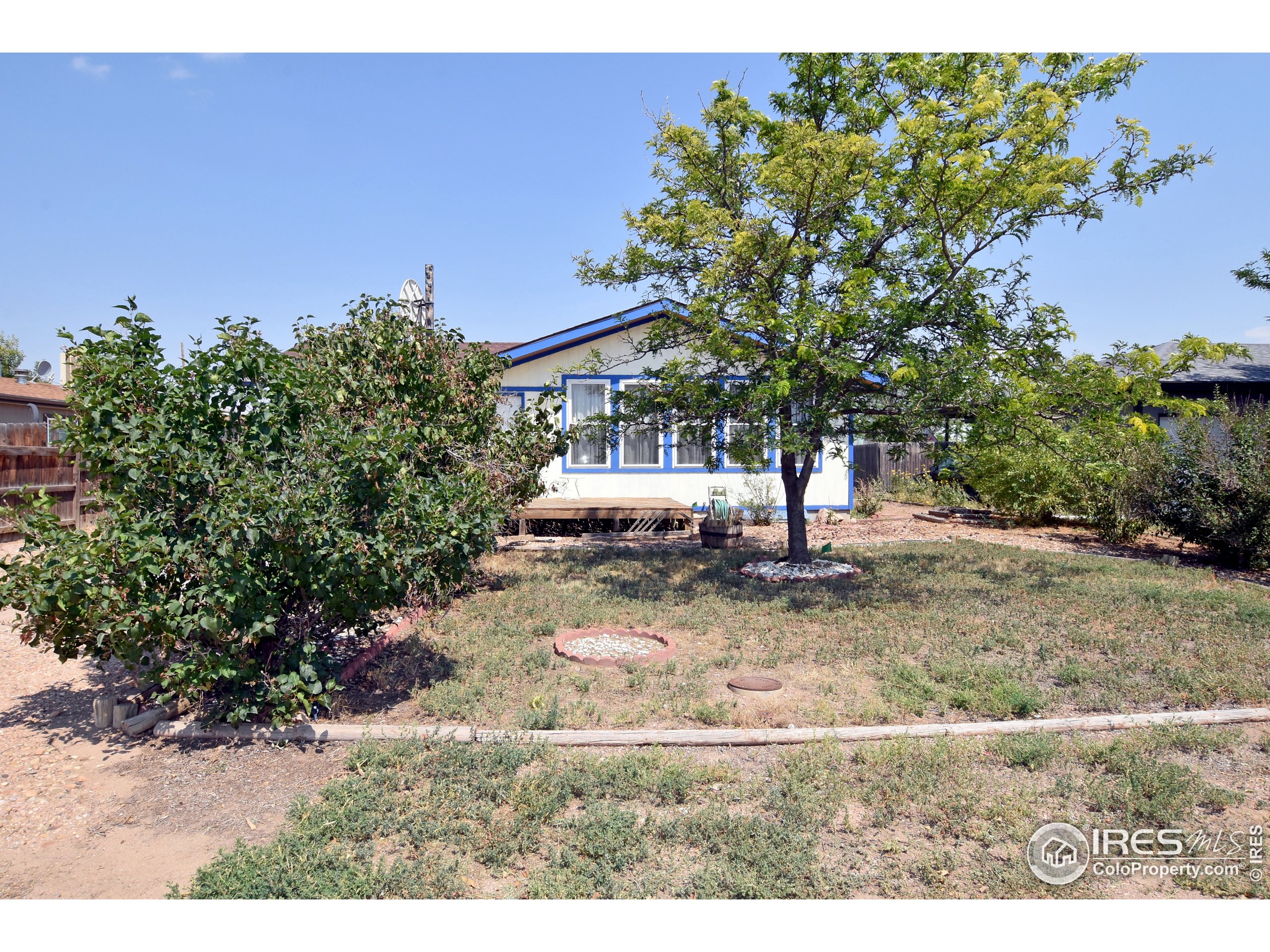 207 Cave Avenue Pierce, CO 80650 - Photo 3 of 35 a view of outdoor space with deck and yard