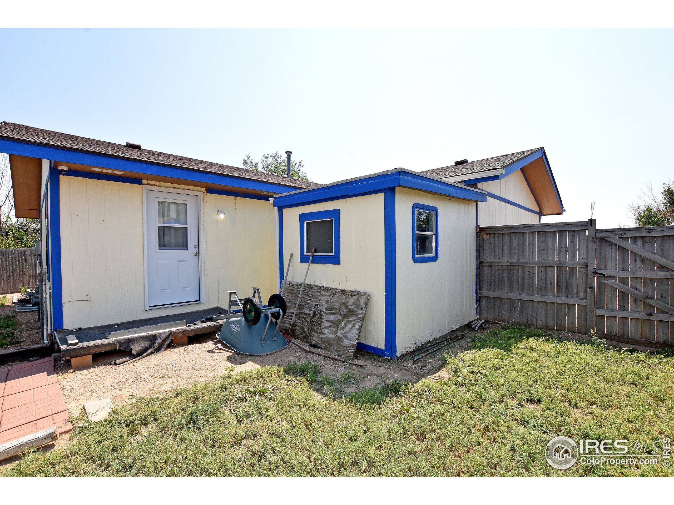 207 Cave Avenue Pierce, CO 80650 - Photo 33 of 35 a view of a house with wooden fence