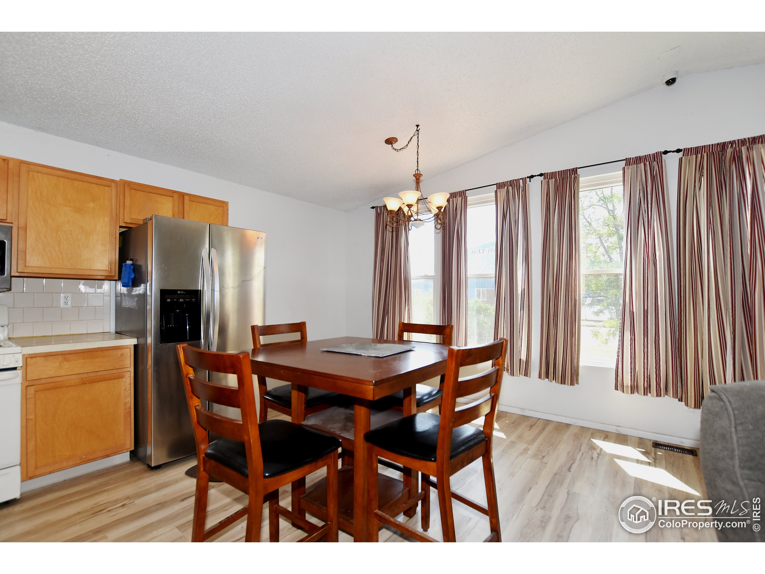 207 Cave Avenue Pierce, CO 80650 - Photo 8 of 35 a dining room with furniture and window