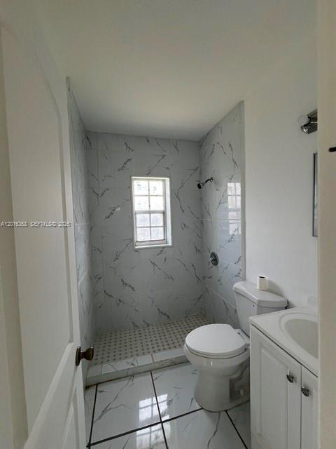 441 Southwest 10th Street, Unit 4 Miami, FL 33130 - Photo 10 of 18 a bathroom with a toilet a sink and mirror