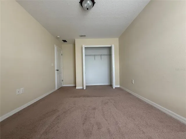 a view of an empty room and a window