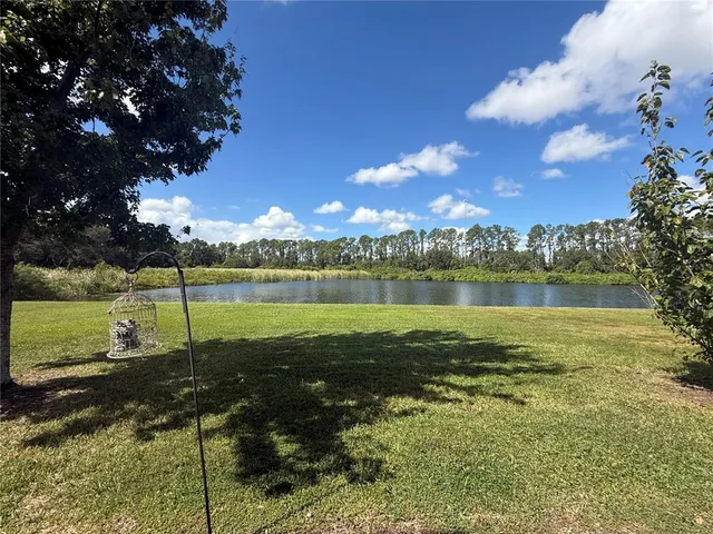 a view of a lake with a big yard